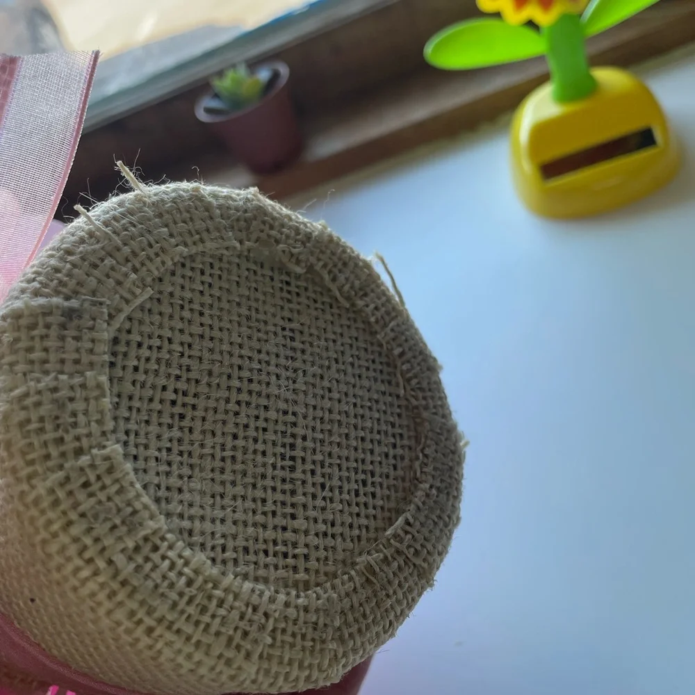 Small Bouquet of Pink Artificial Flowers with a Burlap Pot